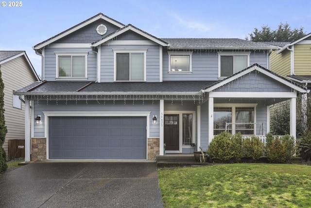 view of front of house featuring a front yard and a garage