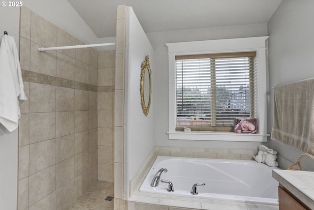 bathroom featuring lofted ceiling, vanity, and independent shower and bath