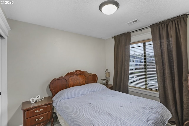 bedroom featuring a textured ceiling