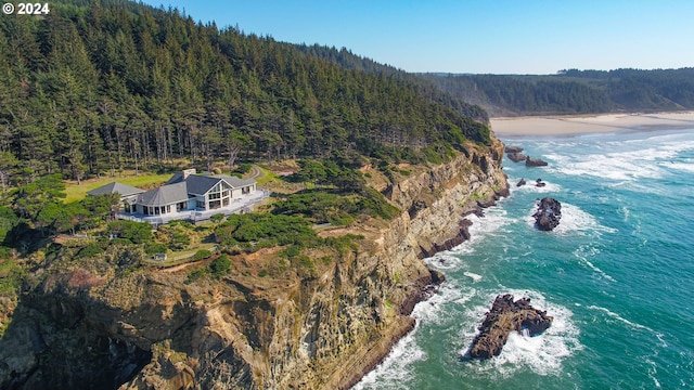 88515 Pacific Surf Ln, Bandon, OR 97411 - birds eye view of property with a water view and a wooded view