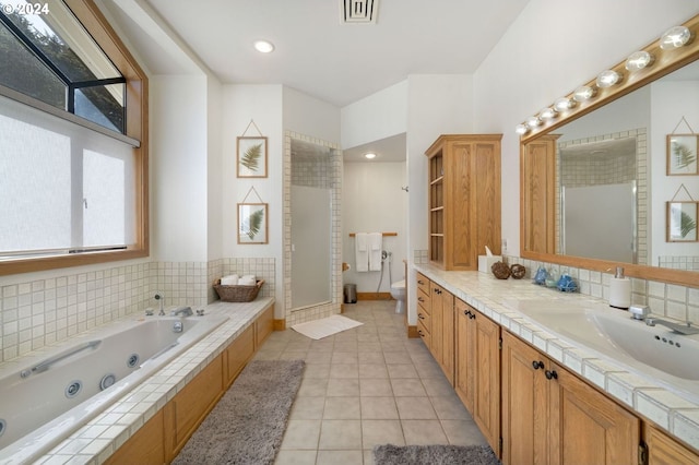 88515 Pacific Surf Ln, Bandon, OR 97411 - bathroom with vanity, a healthy amount of sunlight, tile patterned flooring, and visible vents