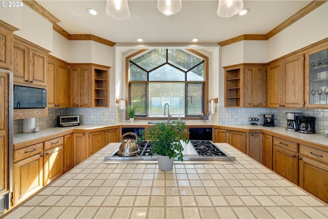 88515 Pacific Surf Ln, Bandon, OR 97411 - kitchen featuring tile countertops, crown molding, open shelves, and a sink