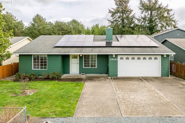 35363 Bayside Gardens Rd, Nehalem, OR 97131 - view of front of house with an attached garage, roof with shingles, and roof mounted solar panels