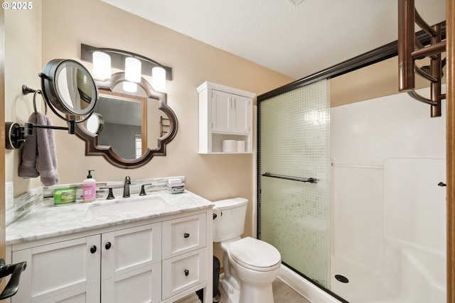 35363 Bayside Gardens Rd, Nehalem, OR 97131 - bathroom with a shower stall, toilet, and vanity