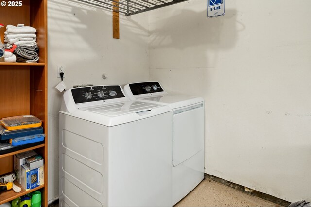 laundry area featuring separate washer and dryer and laundry area