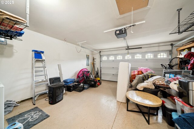 garage featuring a garage door opener and electric panel