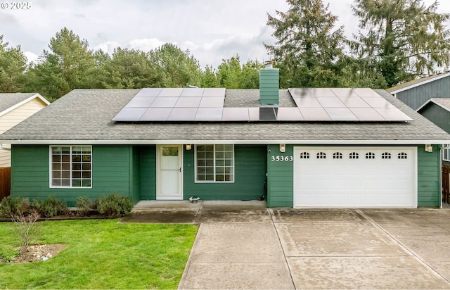 35363 Bayside Gardens Rd, Nehalem, OR 97131 - view of front facade featuring an attached garage, roof with shingles, a chimney, and a front lawn