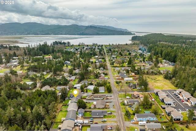 35363 Bayside Gardens Rd, Nehalem, OR 97131 - aerial overview of property's location with a water and mountain view and nearby suburban area