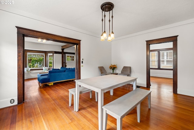 3113 SE Main St, Portland, OR 97214 - dining area with baseboards and wood finished floors