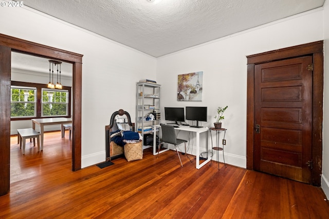3113 SE Main St, Portland, OR 97214 - home office with baseboards, wood-type flooring, and a textured ceiling