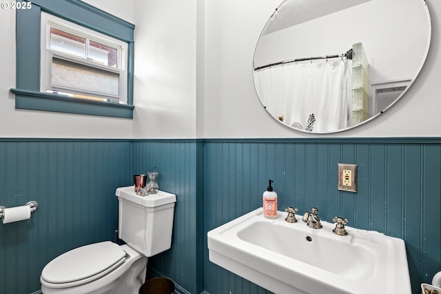 3113 SE Main St, Portland, OR 97214 - bathroom with a sink, toilet, and a wainscoted wall