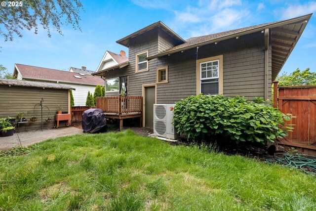 3113 SE Main St, Portland, OR 97214 - back of property with a wooden deck and a cooling unit