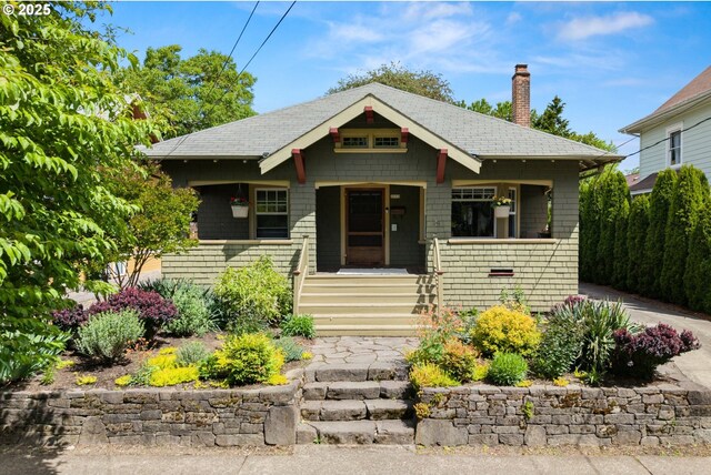 3113 SE Main St, Portland, OR 97214 - view of front of home featuring a chimney, covered porch, and a shingled roof