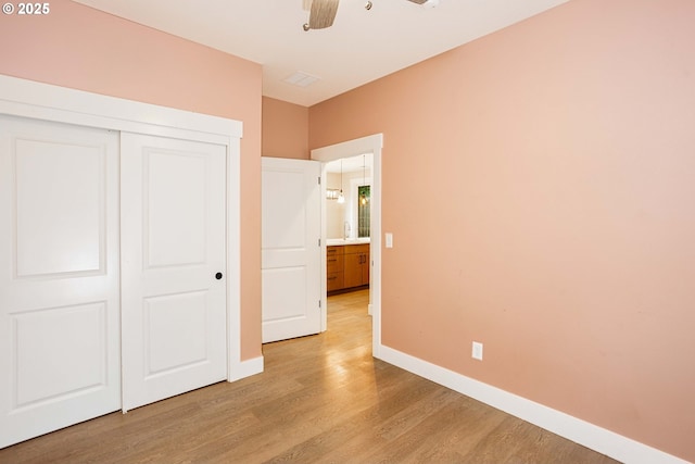 2220 NE Brendan Cir, Vancouver, WA 98663 - unfurnished bedroom with light wood-style flooring, a closet, and a ceiling fan