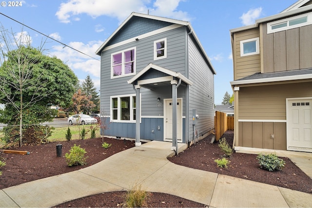 6050 SE 136th Ave, Portland, OR 97236 - view of front of property with fence and board and batten siding