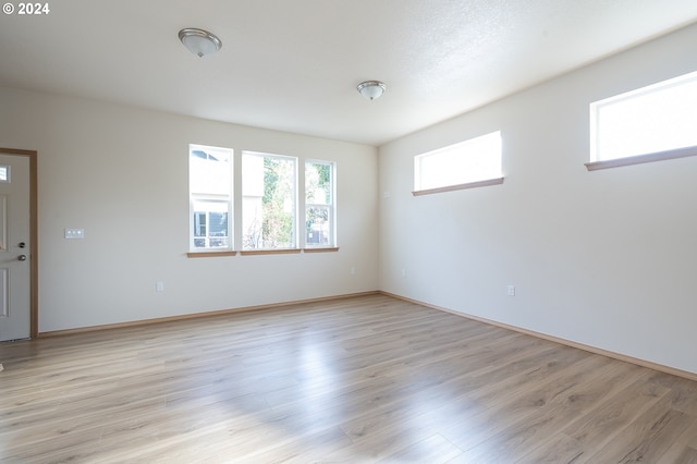 6050 SE 136th Ave, Portland, OR 97236 - unfurnished room featuring light wood-style floors and baseboards