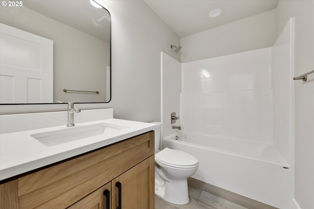 full bath featuring toilet, tub / shower combination, and vanity