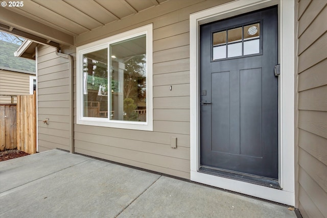 doorway to property with fence