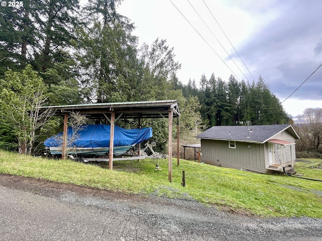 54825 Robinson Rd, Coquille, OR 97423 - view of parking / parking lot with a carport and driveway