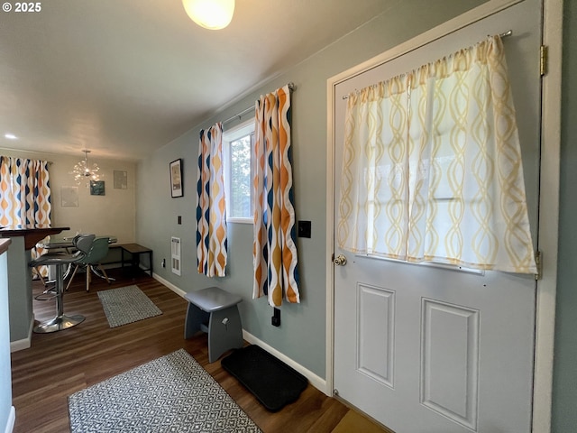 54825 Robinson Rd, Coquille, OR 97423 - foyer with wood finished floors, baseboards, and a chandelier