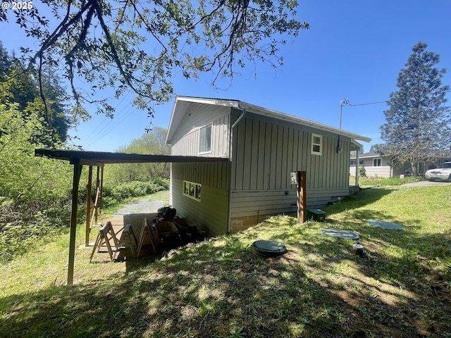 54825 Robinson Rd, Coquille, OR 97423 - view of side of property with board and batten siding and a lawn