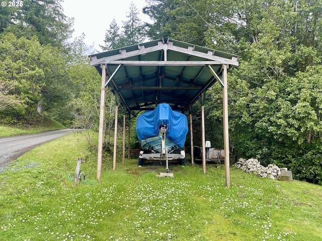 54825 Robinson Rd, Coquille, OR 97423 - view of outdoor structure featuring a carport and driveway