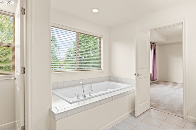 full bathroom featuring plenty of natural light, a bath, tile patterned floors, and recessed lighting