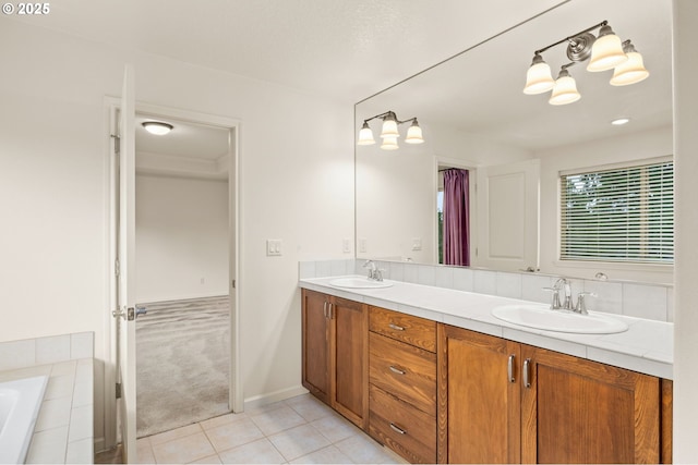 full bath with tile patterned floors, double vanity, and tiled tub