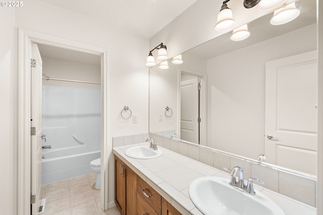 full bath with double vanity, toilet, and bathtub / shower combination