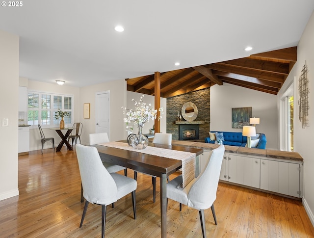 13920 Shireva Dr, Lake Oswego, OR 97034 - dining space featuring a stone fireplace, light wood-style flooring, and recessed lighting