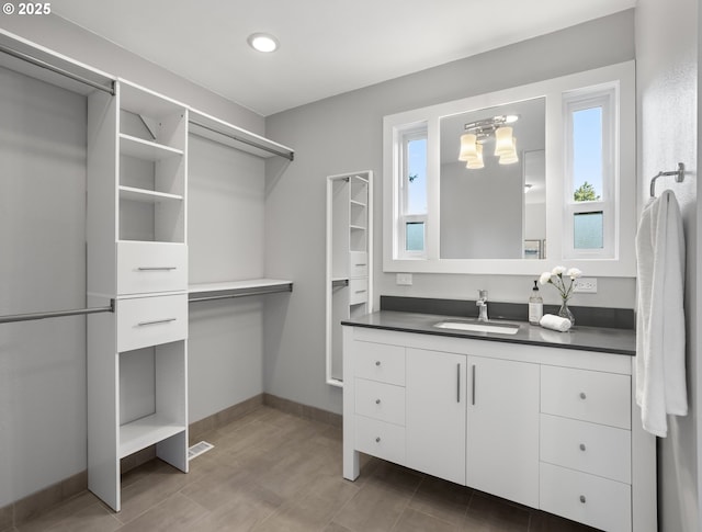 13920 Shireva Dr, Lake Oswego, OR 97034 - spacious closet with a sink and a chandelier