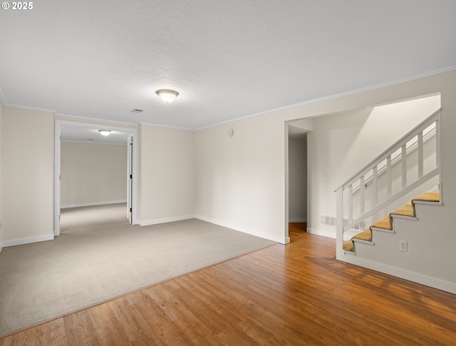 13920 Shireva Dr, Lake Oswego, OR 97034 - spare room with wood finished floors, crown molding, and stairway