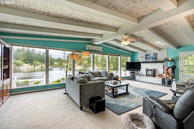 carpeted living area with a wall mounted AC and a ceiling fan
