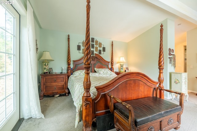 carpeted bedroom featuring vaulted ceiling
