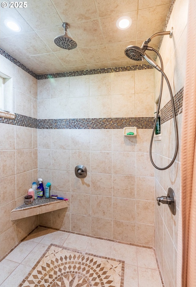 full bath with recessed lighting, tiled shower, and tile patterned flooring