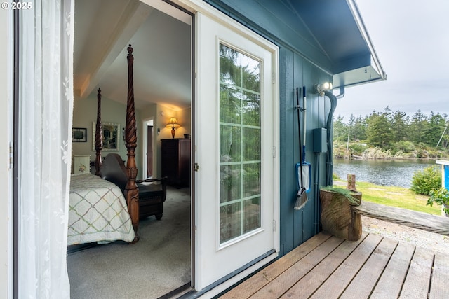 doorway to property featuring a water view and board and batten siding
