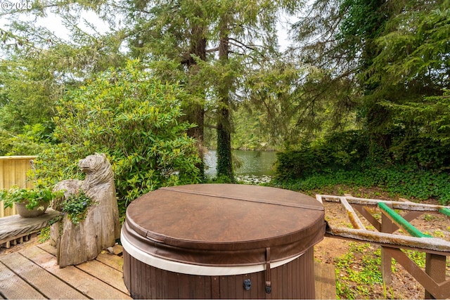 wooden deck with a water view