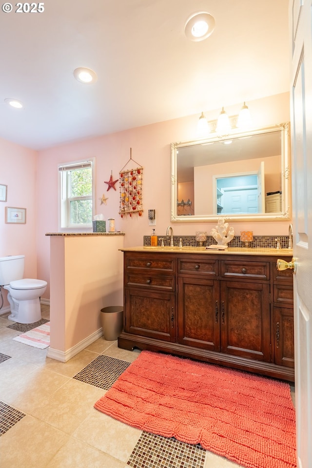 bathroom featuring toilet, vanity, recessed lighting, and tile patterned flooring