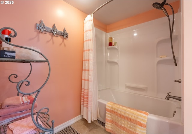 full bath with tile patterned flooring, shower / tub combo, and baseboards