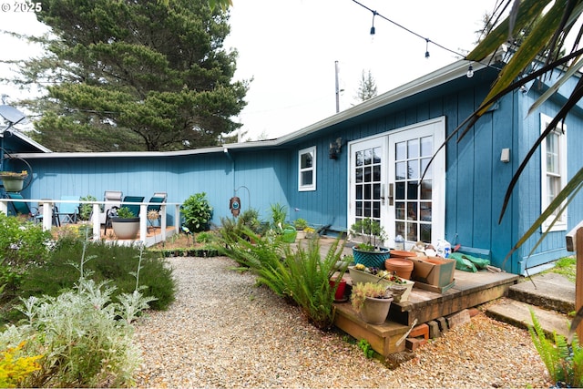 rear view of property with french doors
