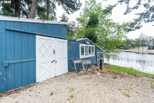 view of shed with a water view