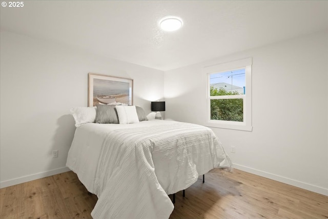 bedroom featuring hardwood / wood-style flooring