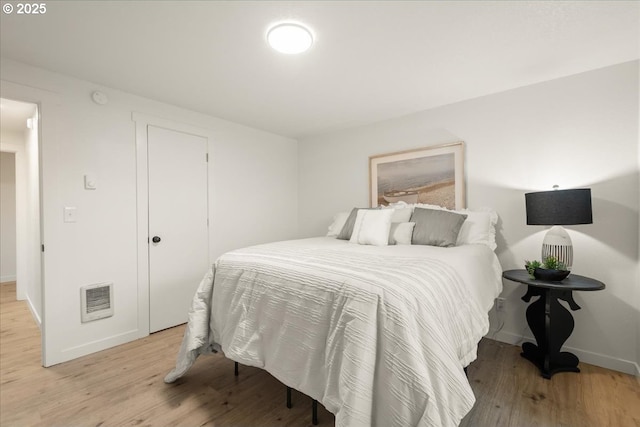 bedroom with light wood-type flooring