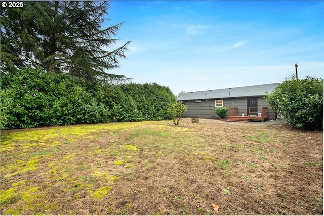 view of yard with a deck