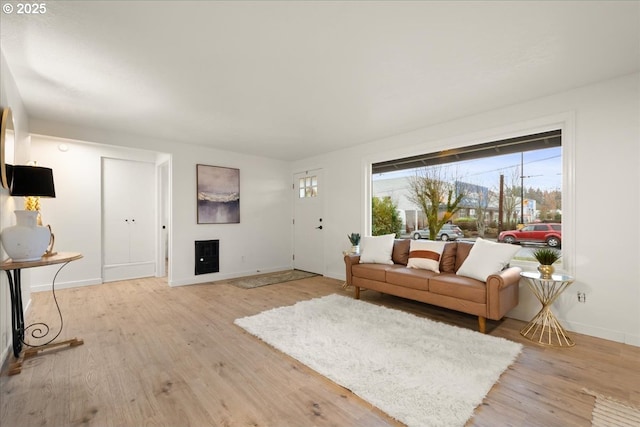 living room with light hardwood / wood-style floors