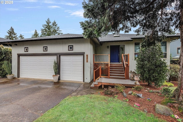 single story home with an attached garage, driveway, and a shingled roof