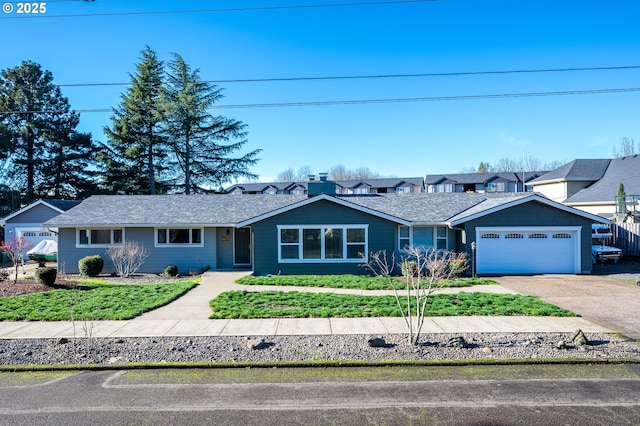 single story home featuring driveway and an attached garage