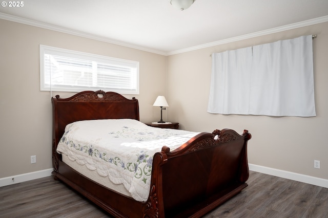 bedroom featuring crown molding, wood finished floors, and baseboards