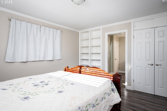 bedroom featuring ornamental molding, a closet, dark wood finished floors, and baseboards