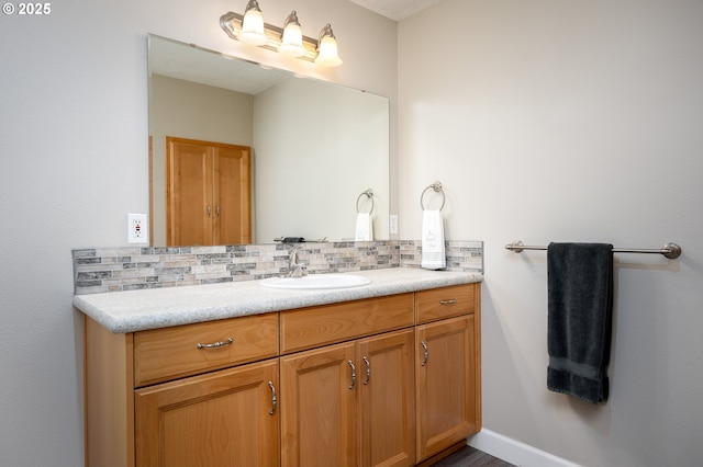 bathroom with backsplash and vanity